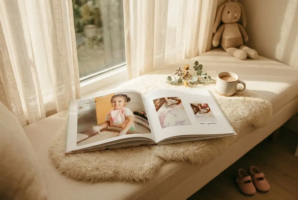 An open Crimsie photo book on a couch